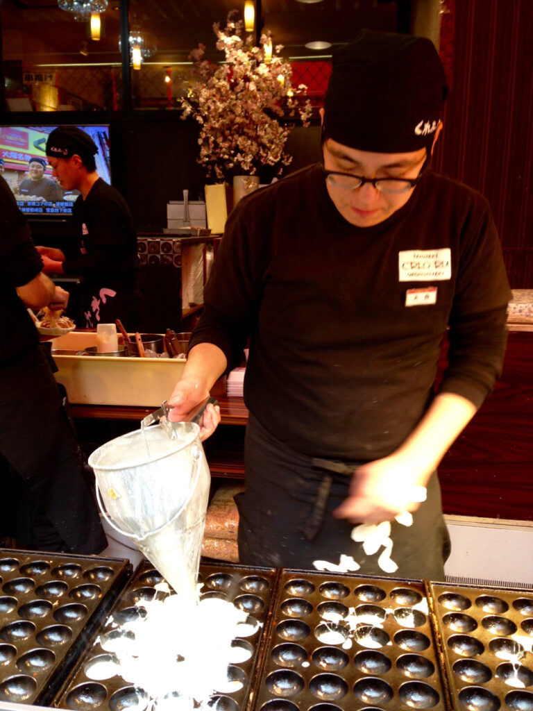 Chef making takoyaki